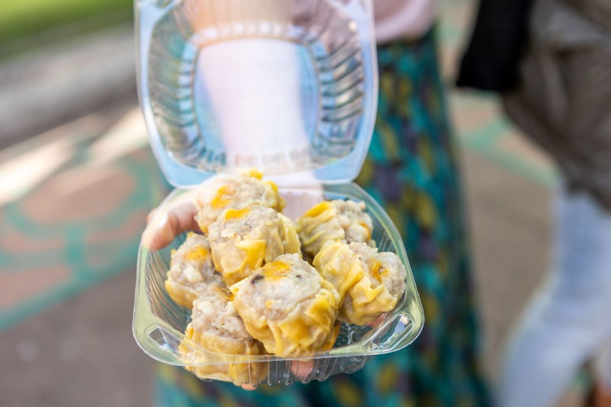 Dumplings in a plastic container while on a tour of NYC.