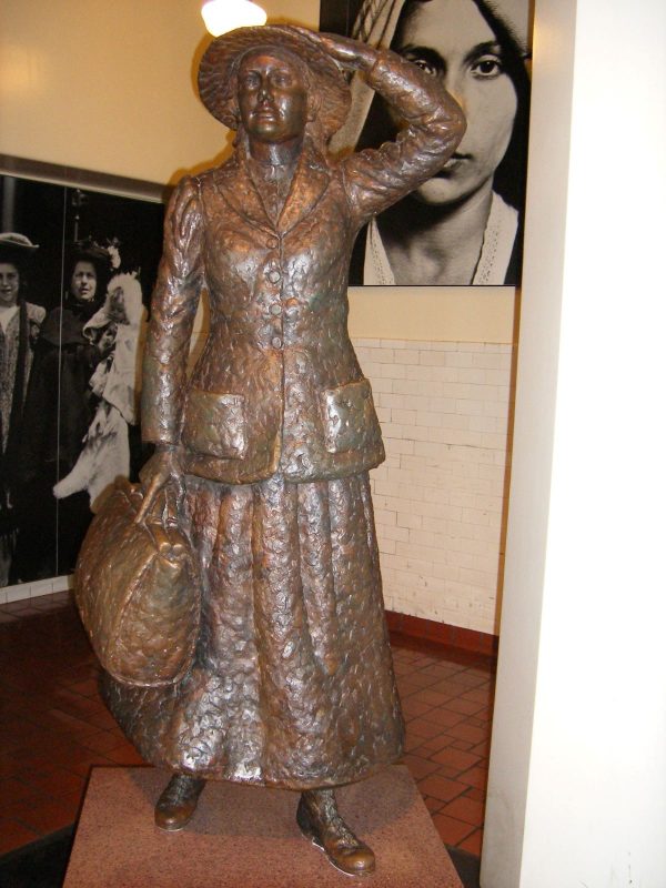Bronze sculpture of Annie Moore at Ellis Island.