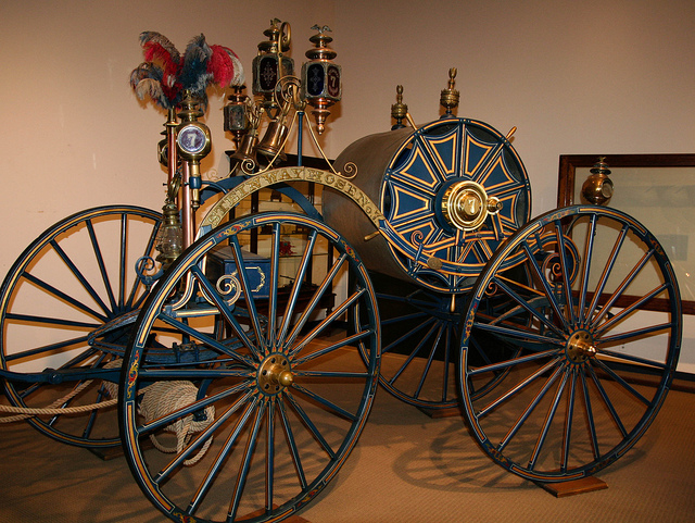 An old fire engine in the New York City Fire Museum, one of the best museums in NYC. Photo by Sharon Mollerus. https://www.flickr.com/photos/clairity/11738749233/in/photolist-iTjaba-iTmZmh-iTjveh-iThCpp-iTjCgd-iTjMR5-iTmotb-cEdSGo-hW2kMN-iTmxoW-cEdLN1-Gzncv-cEdMrC-cEdMQY-9qC1Nq-eqVfE4-b4M7ae-cr2GCj-cr2HJE-cr2GeY-cr2Fxo-cr2GY5-cr2F8S-cr2JpY-idzeyL-gjDwDs-7KmbEs-4nBGW8-jwodeV-n1TaXZ-eg9yha-NSdFg-jKSkKf-aRvTXP-asraK-e4P43U-7jU2EN-bAKeW1-CMH79t-9qBYHf-rGFPXt-sDuNvV-sDj9tQ-sDiZrb-4oLbcM-sDtH76-sDtJVB-sn3dGV-cEdSgu-Au3cM7