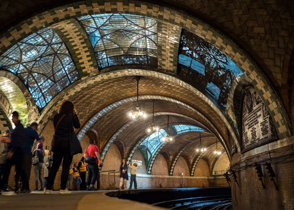 People taking pictures inside one of the secret places in NYC, City Hall subway station. 