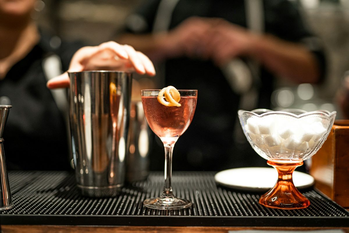 Bartenders making cocktails at a speakeasy in NYC.