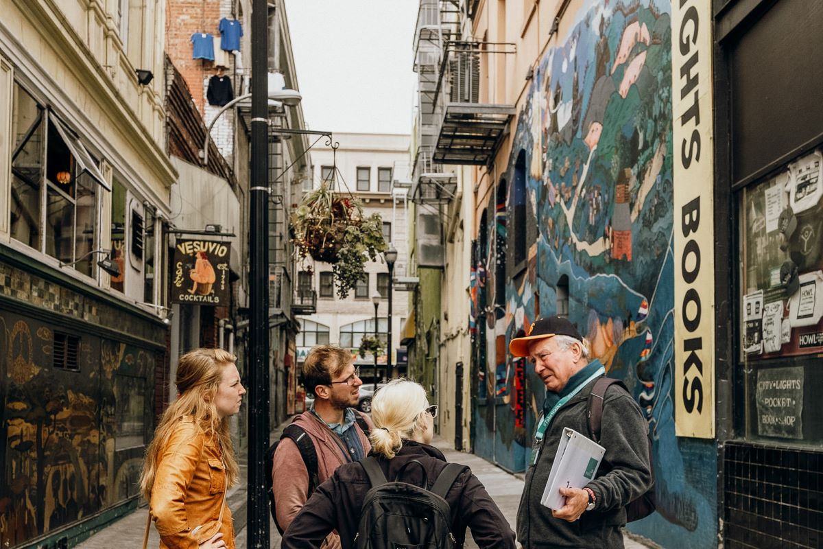 A tour guide chats with a group of guests in San Francisco's Telegraph Hill neighborhood.