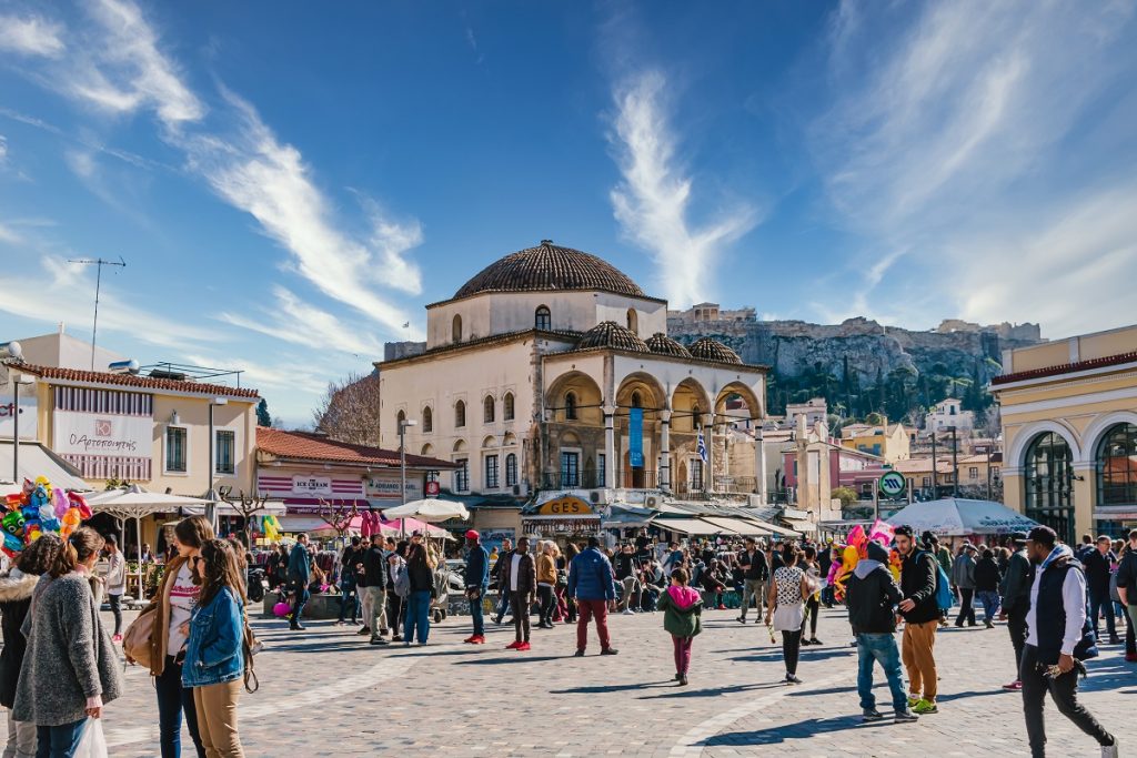 Monastiraki Square in Athens, Greece with the Monastiraki Flea Market in foreground.