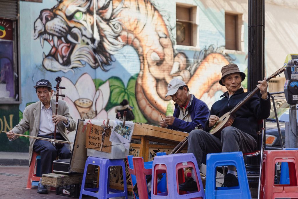Musicians playing stringed instruments on the street in San Francisco's Chinatown