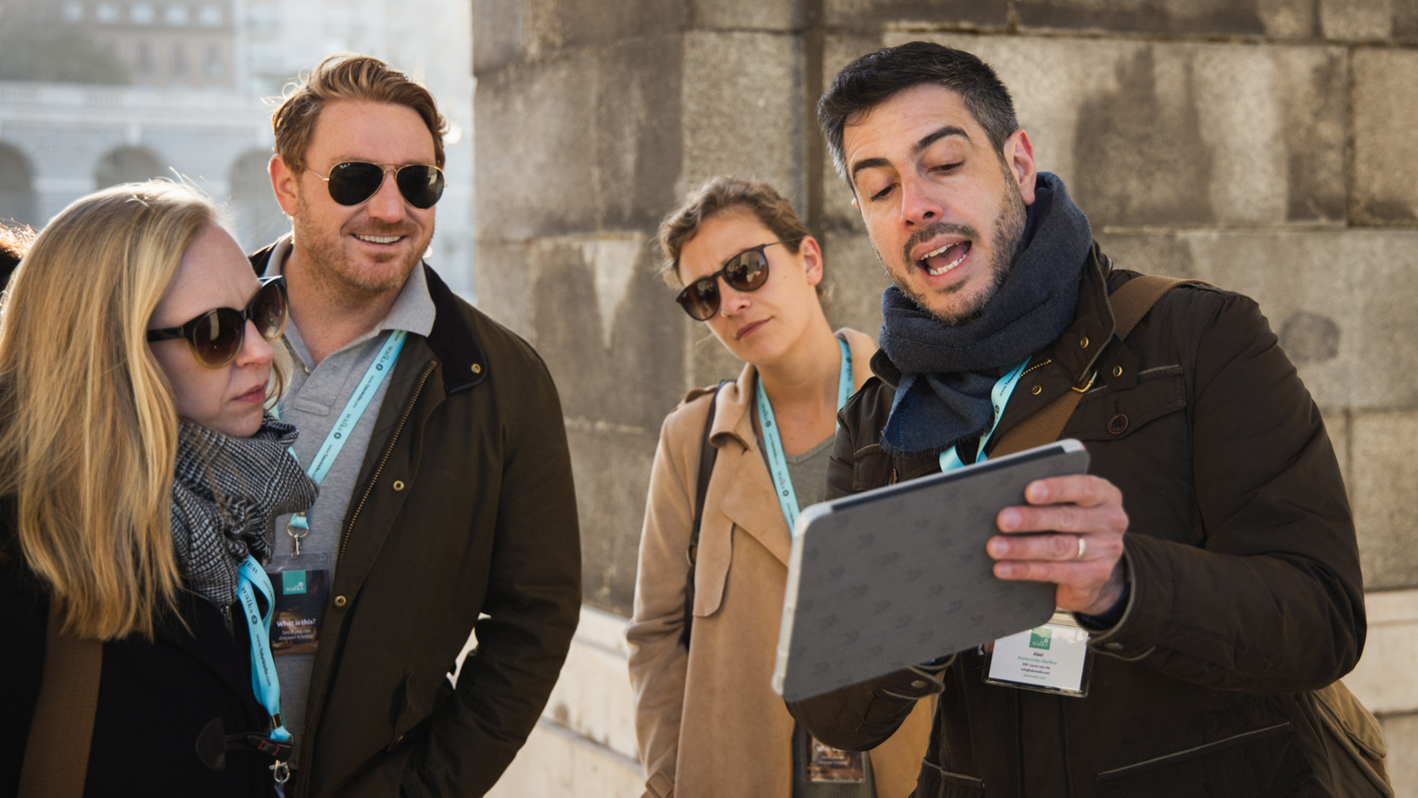 Tour guide explains the history of Madrid to city visitors