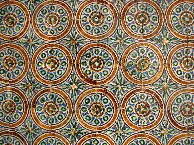 Sevillian tiles (pattern is circular and the colors are a harmonious blend of brown, blue, green and white)