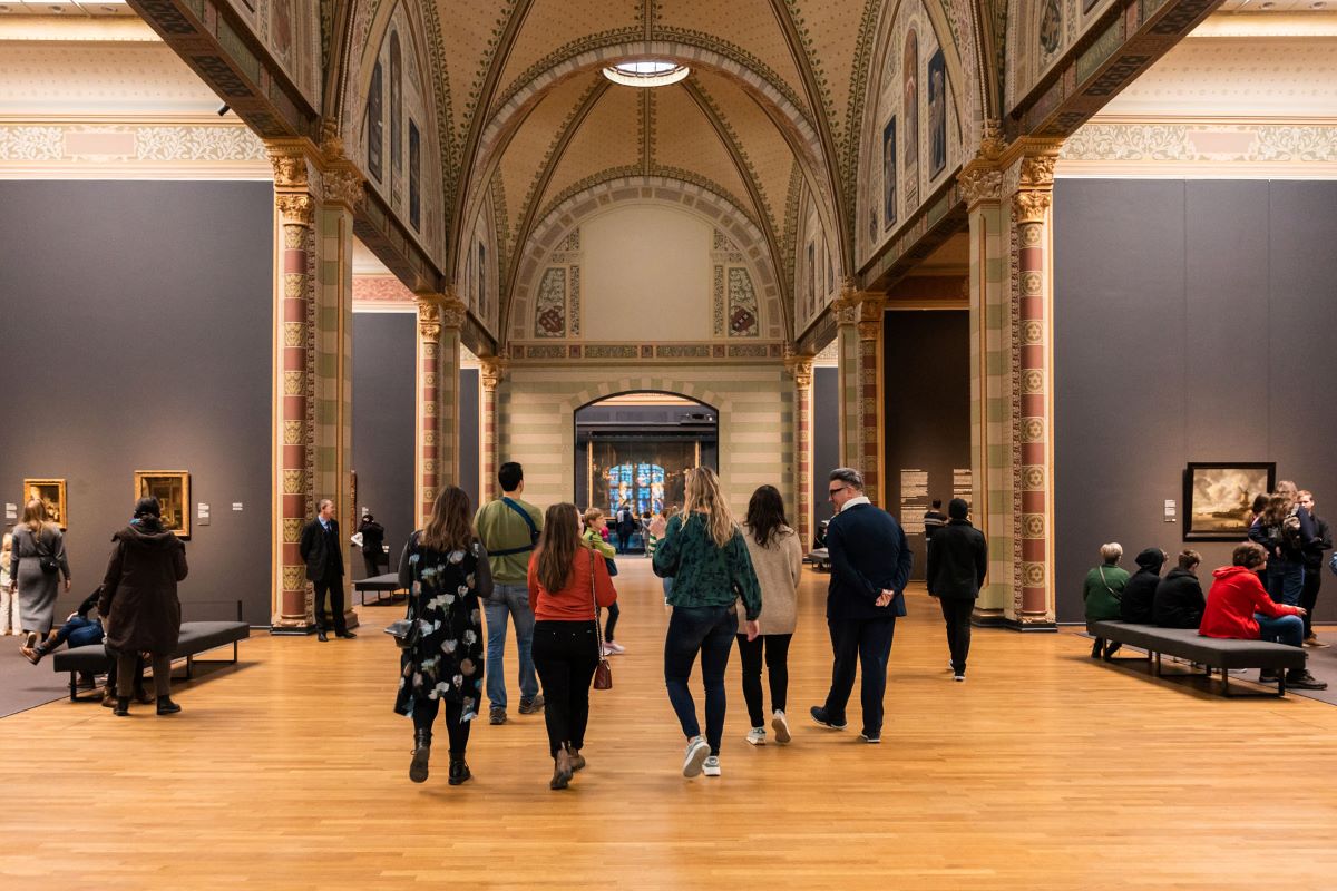A group walking through the Rijksmuseum in Amsterdam.