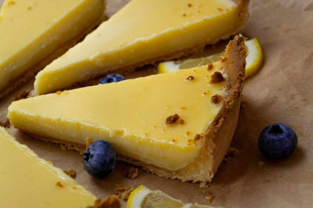 Slices of lemon tart with blueberries