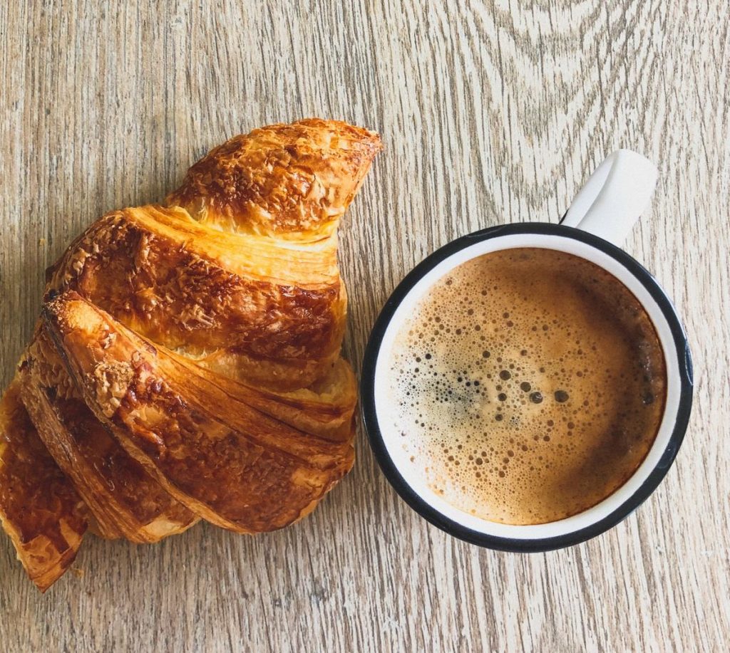 Croissant and coffee on a table