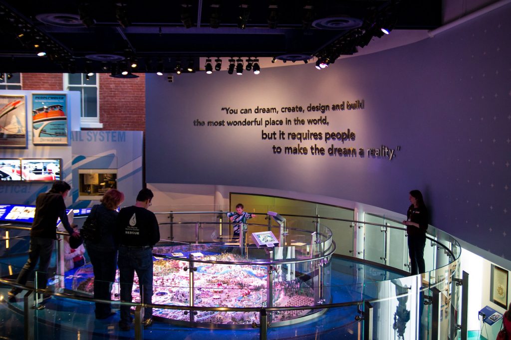 Group visiting an exhibit with movie set design and quote at the San Francisco Walt Disney Family Museum 