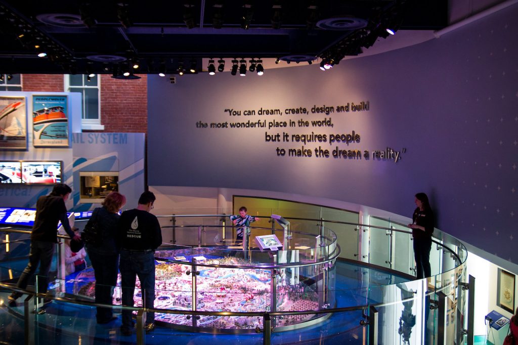 Group visiting an exhibit with movie set design and quote at the San Francisco Walt Disney Family Museum