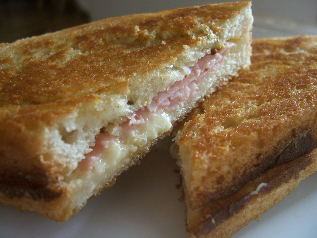 cheese and ham sandwhich on a plate