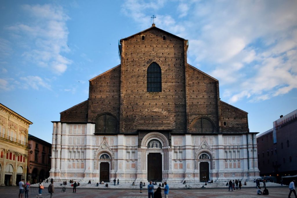 A large church inside a city square, home to one of the biggest festivals in Bologna