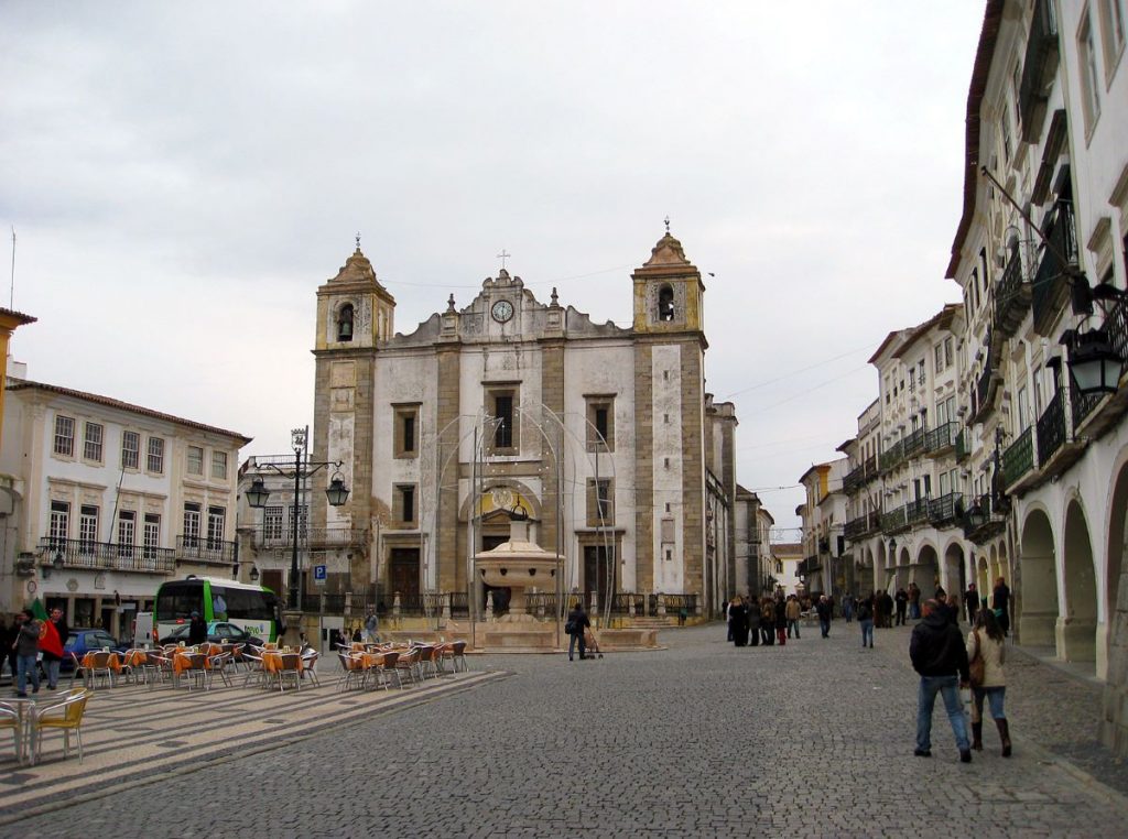 people walking in the main square in a city