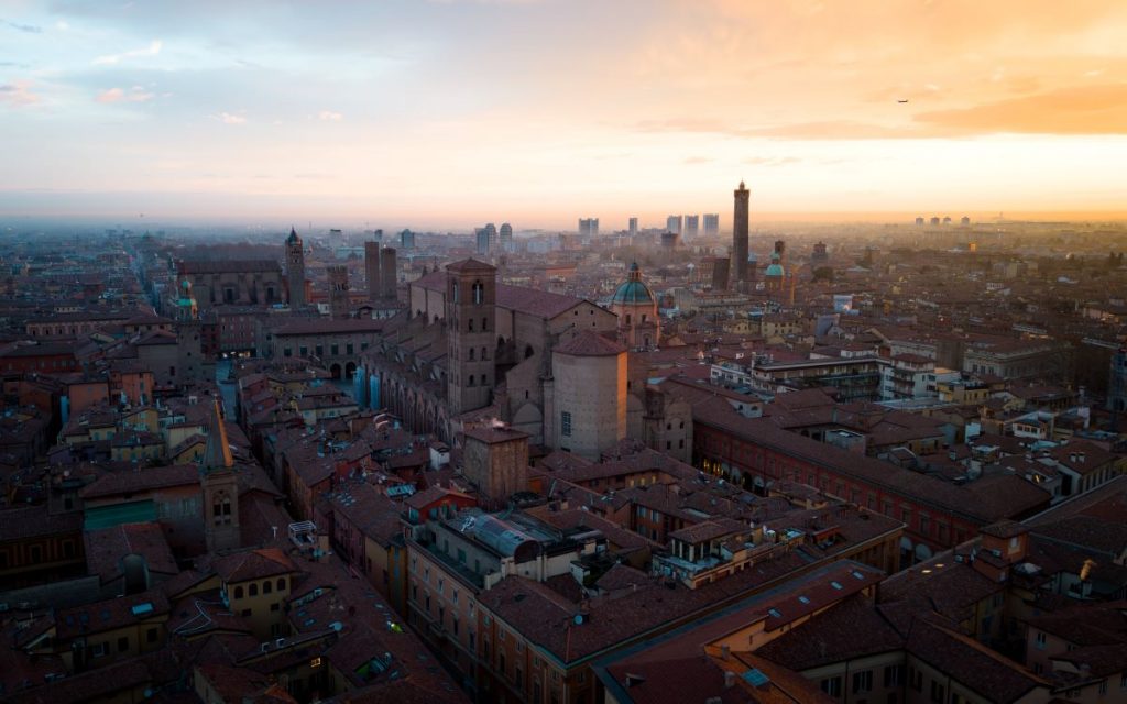 The sun rising on the city of Bologna