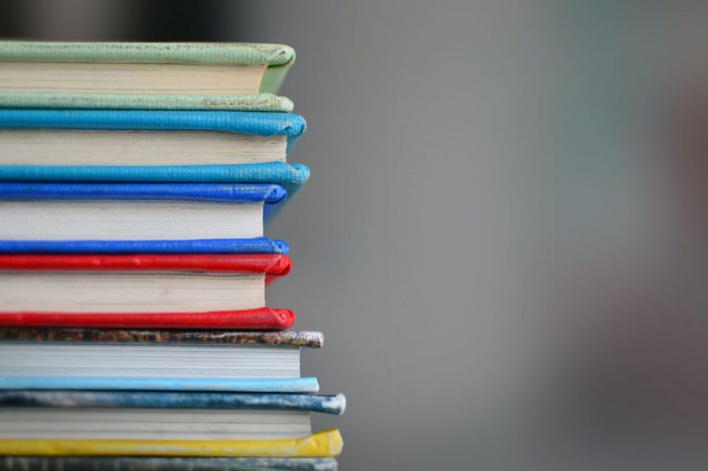 A stack of books in different colors
