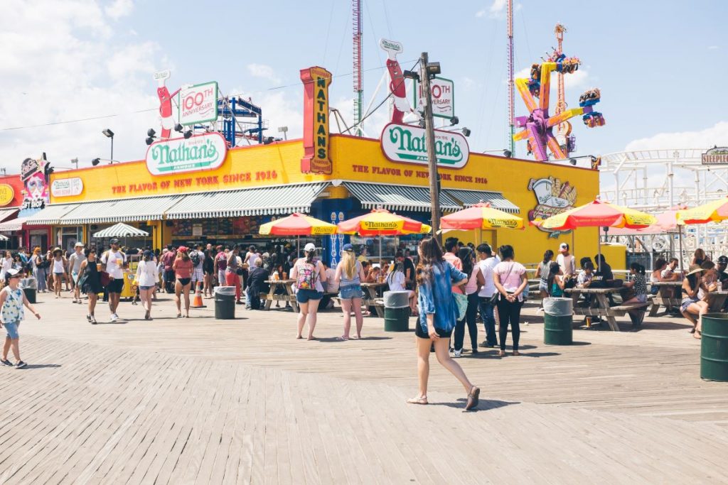 People watlking on a crowded boardwalk