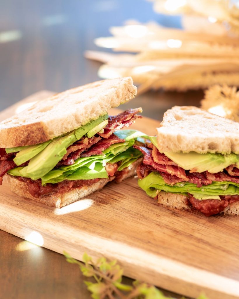 Freshly cooked sourdough BLT cut in half from one of San Francisco's best bakeries.