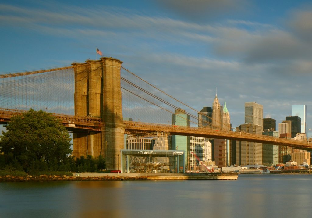 Bridge with cityscape in background