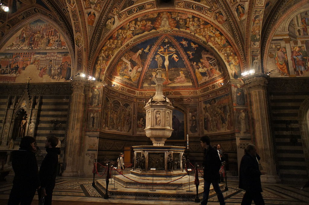 Baptismal font underground Siena Baptistry artificial lights