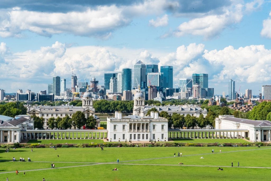 Sunny day in London with buildings and green park after COVID