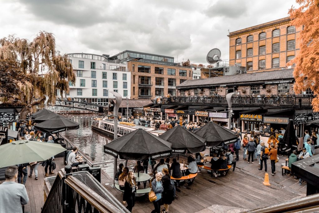 Camdem Town in London after COVID with a lot of people eating during a rainy day