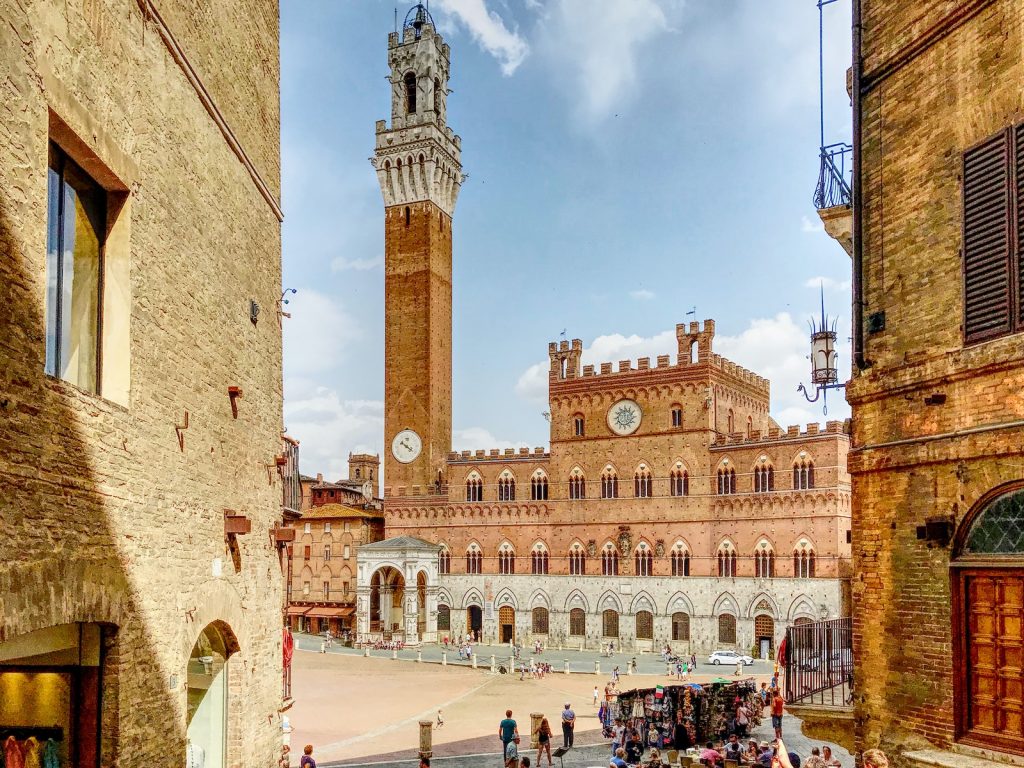 The Tuscan Main Square of Siena in a sunny day with tower