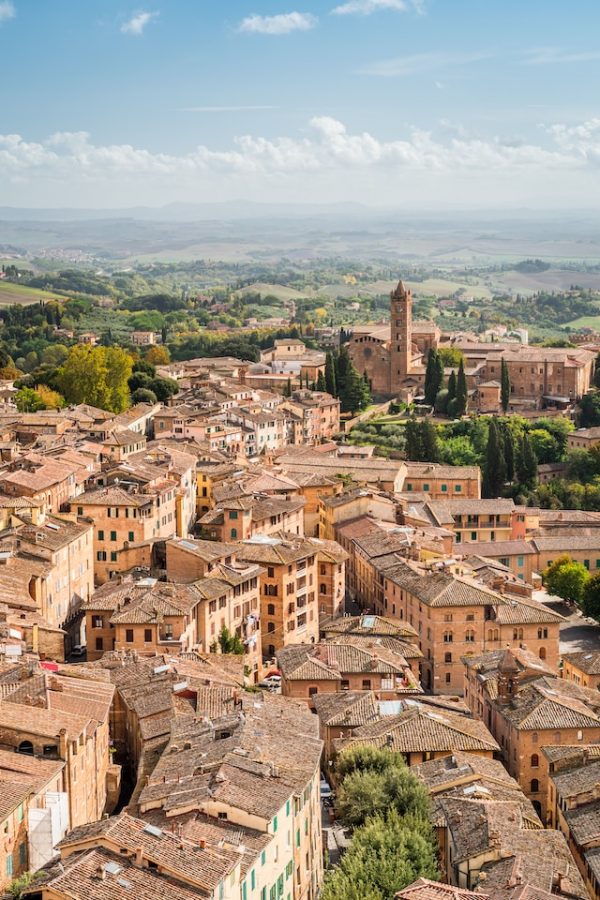 Sky view of Siena Tuscany rooftops blue sky