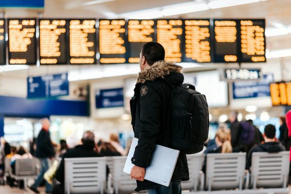 Person carrying luggage at the airport