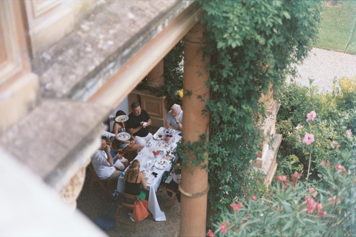 People eating in a terrace on a hidden gem hotel in Naples, Italy