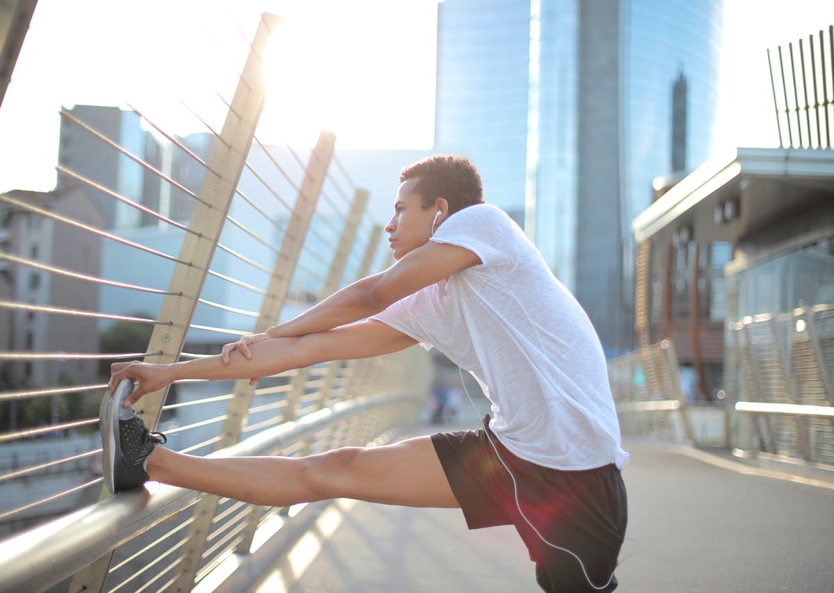 person stretching and preparing for a race