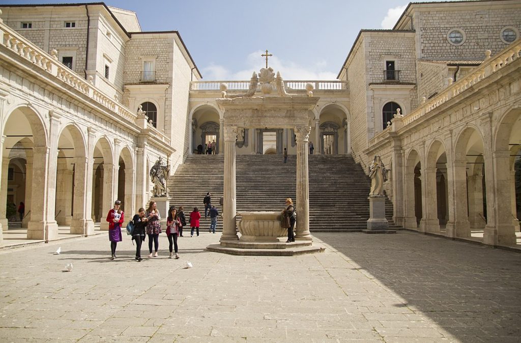 people walking through courtyard of museum in Rome