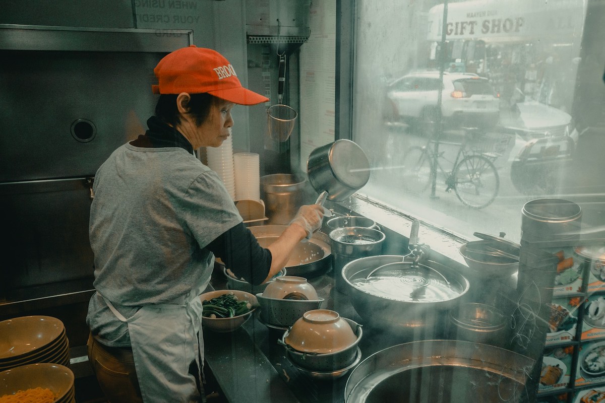 Person cooking at a Chinese store