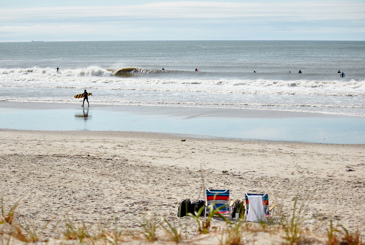 People surfing in Rockaway Beach NYC