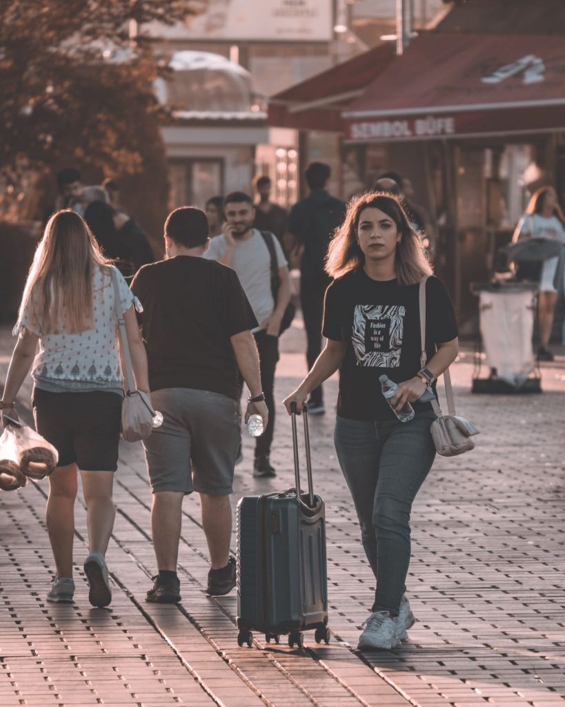 girl walking with luggage