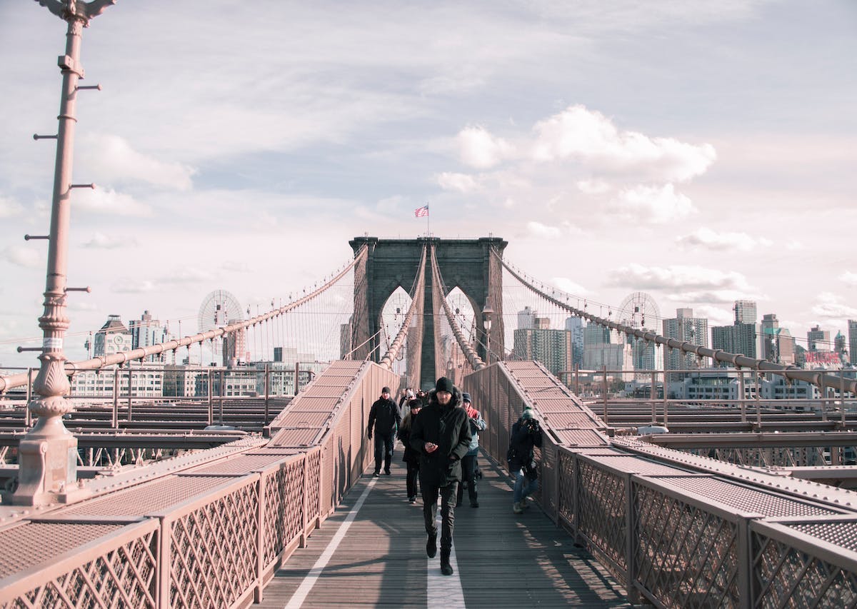 Man walking alone on a bridge