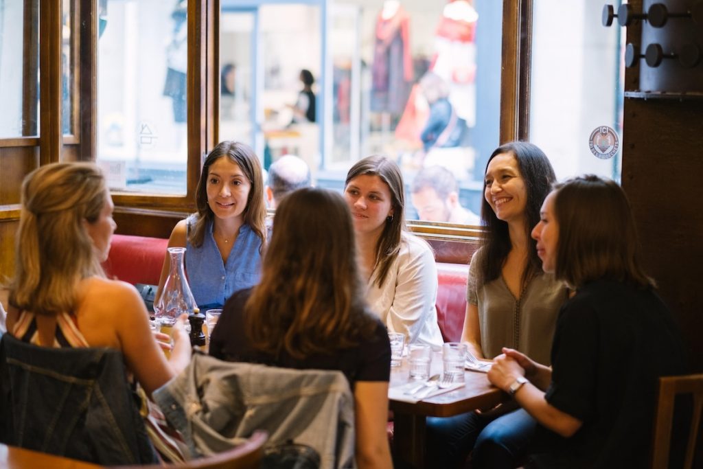 A group of people in Paris on a food tour.