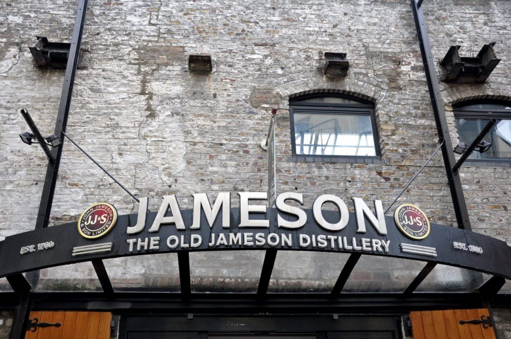 brick building with black metal sign reading Jameson