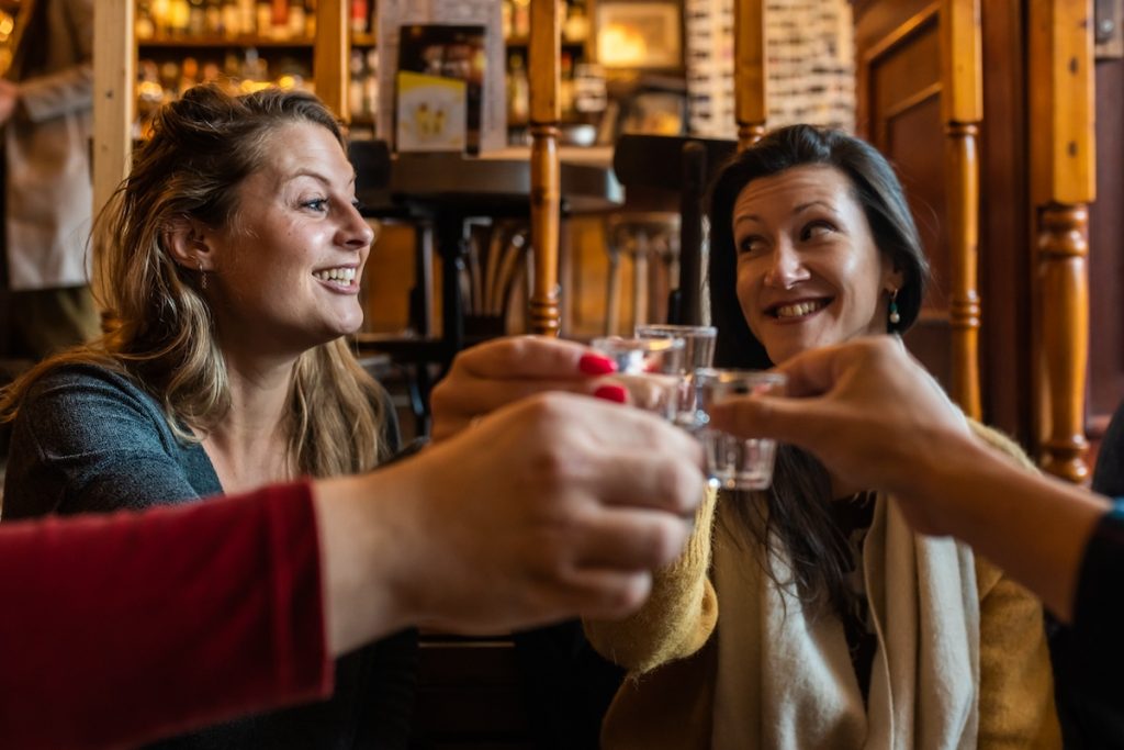 people drinking jenever in Dutch brown cafes.