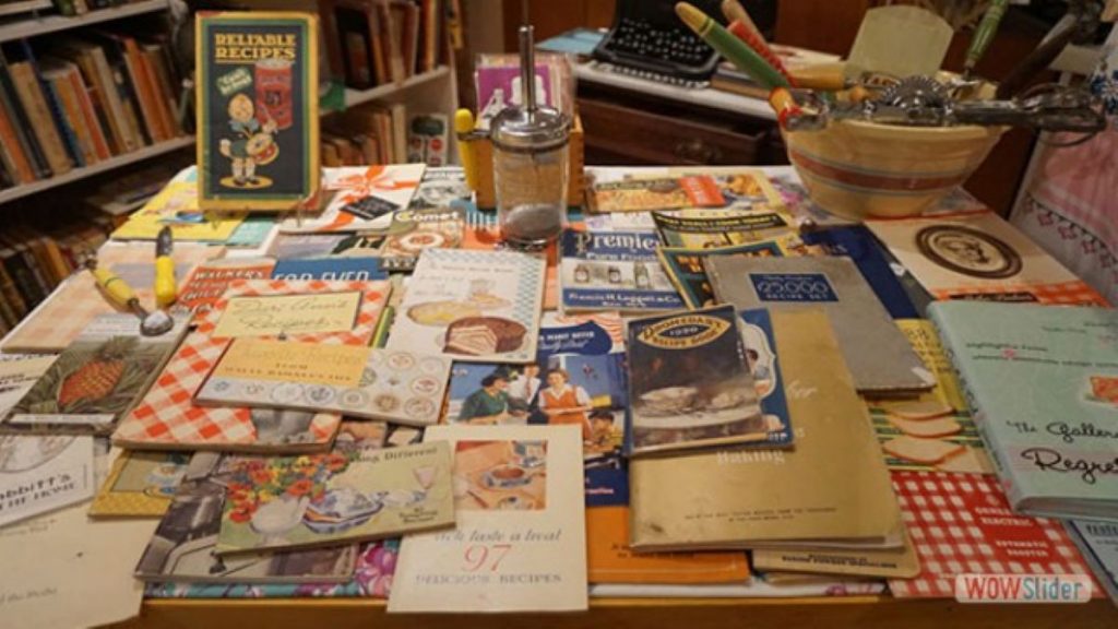 a bookstore display with cookbooks and a tea pot