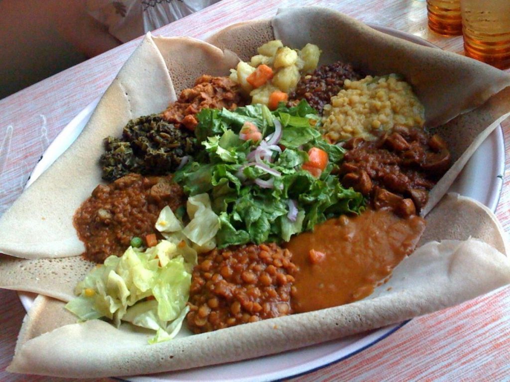 dish with food loaded onto large flatbread