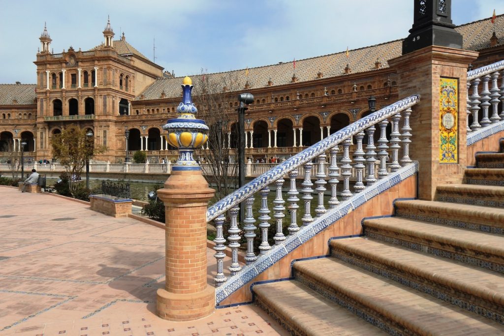 steps with beautiful tiles leading to a small bridge