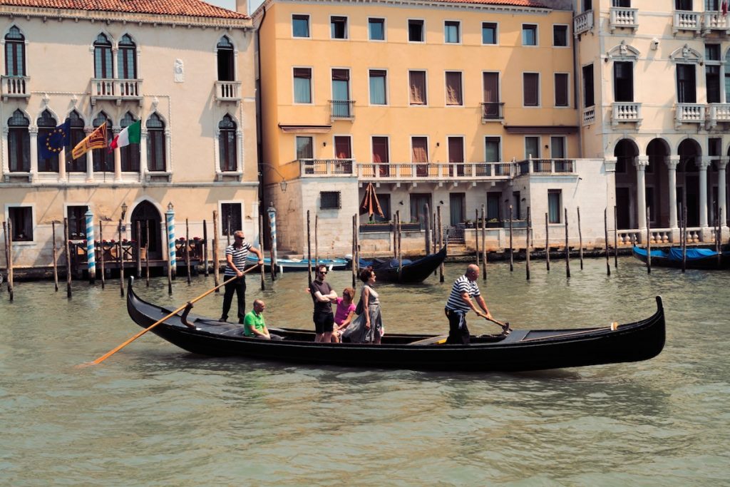 group of people riding on a black gondola