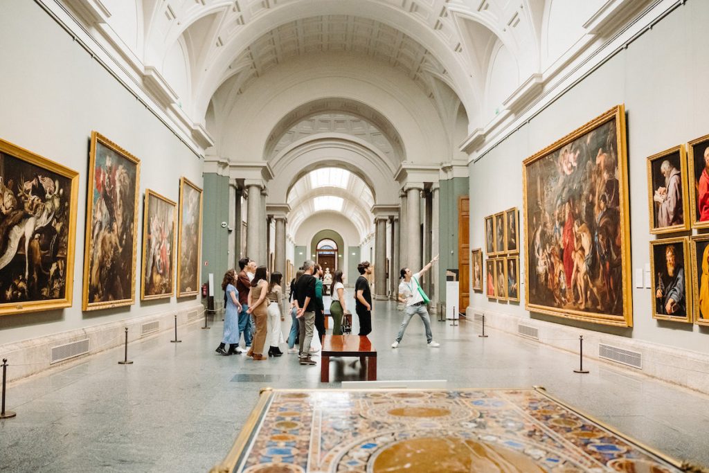 Group in the Prado museum looking at paintings, Madrid