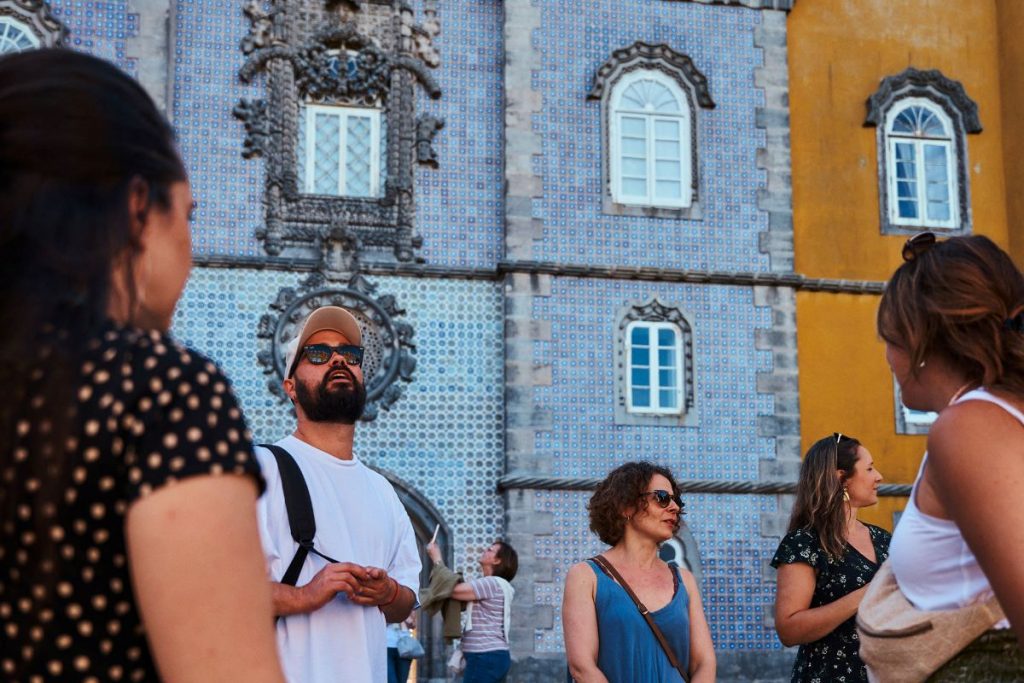 People admiring the exterior of Pena Palace.