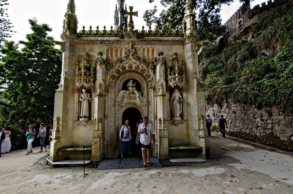 People walking out of a chapel in Sintra.