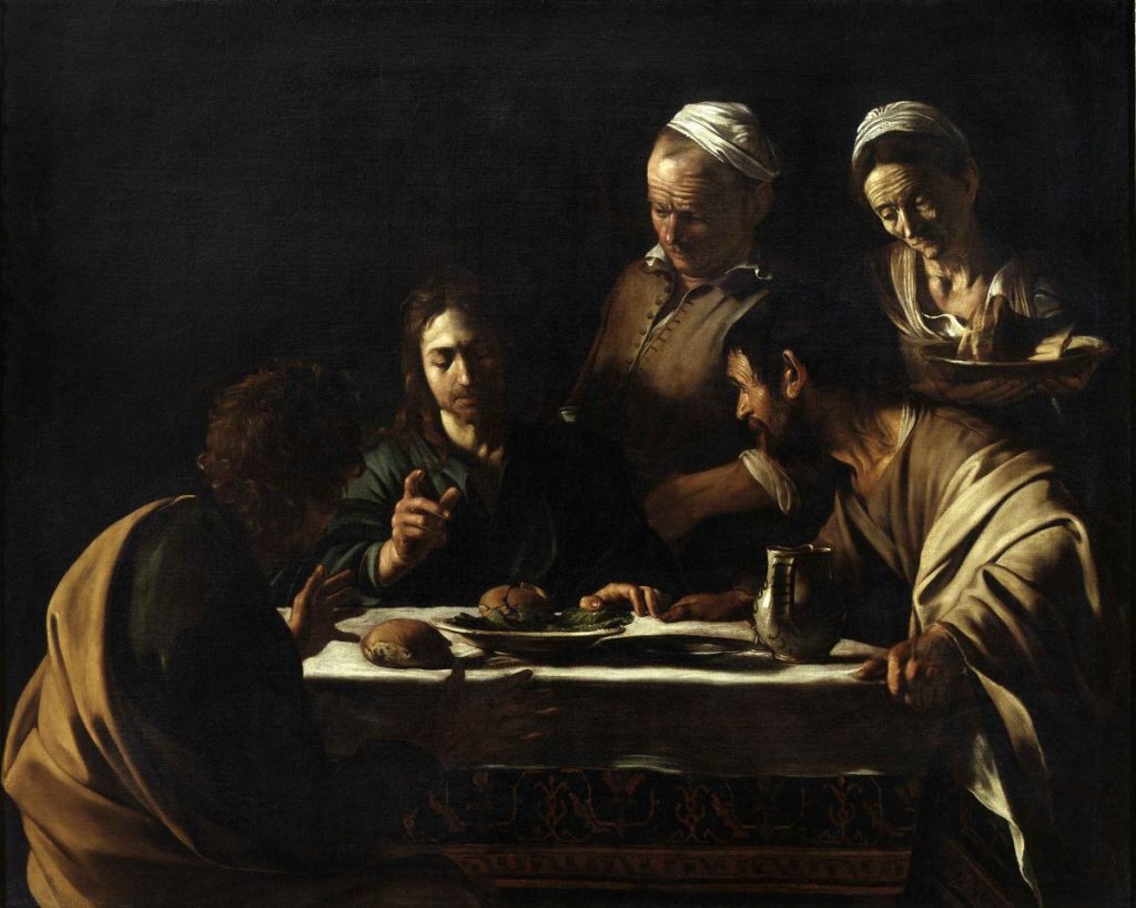At the Pinacoteca di Brera in Milan, four people share bread and wine at a table, intensely focused on conversation.