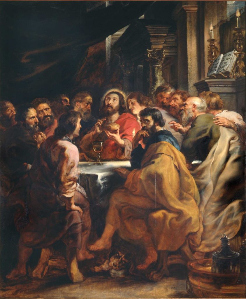 At the Pinacoteca di Brera in Milan, men gather around a table sharing food and conversation; Jesus sits at the center.