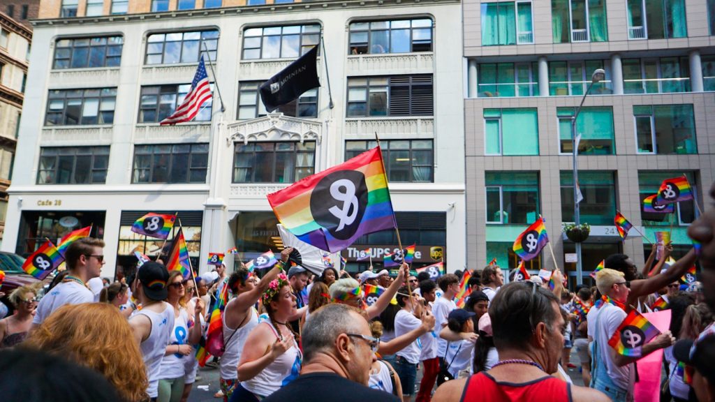 people holding pride flag